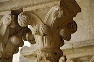 Slender Gothic columns with filigree capitals in the cloister, Gothic basilica of the Cistercian
