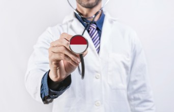 Monaco healthcare system, doctor holding stethoscope. Monaco health and medical insurance concept