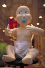 Baby mannequin in a baby equipment shop, New York City, USA