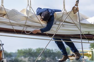 Sailor attaches sail, sailing ship, Kieler Woche, Holtenau, Kiel, Schleswig-Holstein, Germany