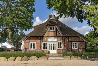 Half-timbered farmhouse with restaurant and café on the Prinzeninsel in the GroÃŸer Plöner See near