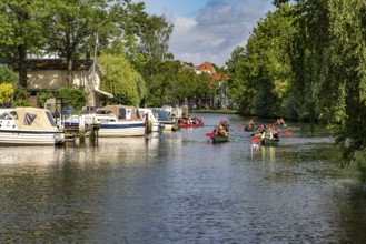 Canoes on the Trave in the Hanseatic city of LÃ¼beck, Schleswig-Holstein, Germany