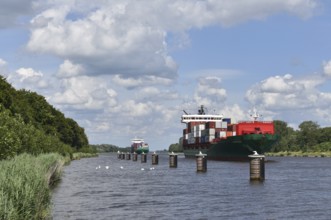 Container ships in a siding, siding area in the Kiel Canal, Kiel Canal, Kiel Canal,