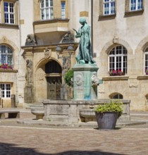 Schlegelbrunnen fountain by sculptor Johannes Hartmann in front of the town hall on Döbeln's