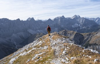 Mountain panorama with picturesque mountain landscape, mountaineers descending from the Gamsjoch,