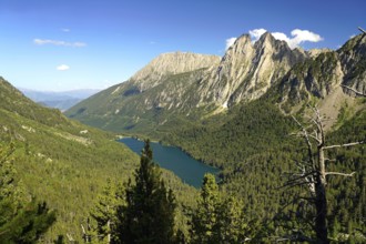Lake Estany de Sant Maurici and the Els Encantats mountain range in the AigÃ¼estortes i Estany de