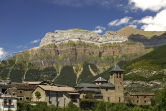 The Iglesia de San Salvador church in Torla and the Monte Perdido massif in Torla-Ordesa, Spain