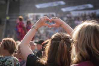 Hands formed into a heart at the Berliner Rundfunk 91.4 Open Air at the Berlin ParkbÃ¼hne Wuhlheide