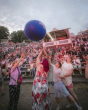 Spectators with ball at the Berliner Rundfunk 91.4 Open Air in the Berlin ParkbÃ¼hne Wuhlheide on