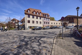 Street, cobblestone pavement, historic buildings, half-timbered house, lantern, parking lane with