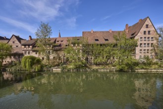 River Pegnitz, historical buildings, houses, trees, reflections, water surface, blue sky,