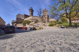 Kaiserburg, castle, castle chapel, round tower, trees, lawn, parking boxes, parking lane, vehicles,