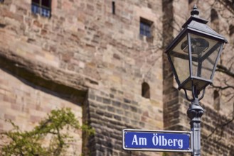Street sign, street name Am Ã–lberg, lantern, castle wall, depth of field, Nuremberg, Middle