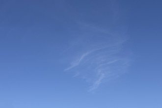 Delicate thin veil clouds Cirrus in front of blue sky. international