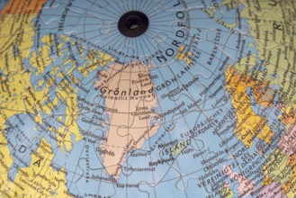 Puzzle globe. Map made from puzzle pieces. Greenland and Denmark