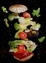 Dynamic depiction of a burger with floating ingredients such as lettuce, cheese, tomatoes and onion