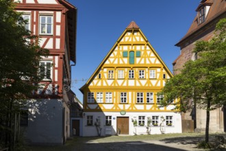 Protestant parish office in historic half-timbered house next to the town church of St Kilian, Bad