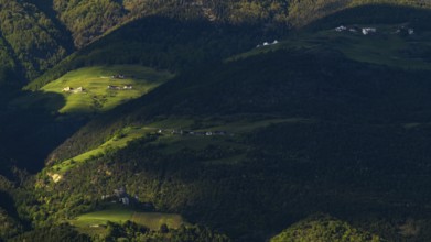 View of the Sonnenberg with Annenberg Castle and the farms above in the evening light, Dolomites,