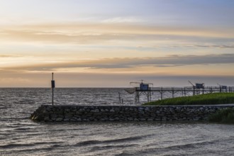 Sunset over Fishing huts over Randonnee entre Histoire et Nature, Fouras, Fouras-les-Bains,