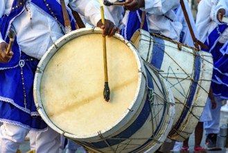 Musicians with their rustic wooden drums and colorful clothes during the religious festival of