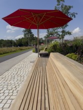Wooden bench with parasol