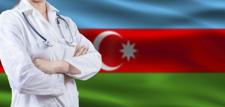 Doctor with crossed arms on Azerbaijan flag. Azerbaijan health and care concept. Female doctor on