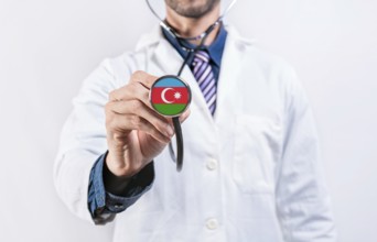 Azerbaijan healthcare system, doctor holding stethoscope. Azerbaijan health and medical insurance