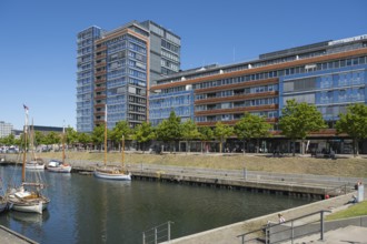 Modern office building and sailing boats at Germaniahafen, museum harbour, Kiel, Kiel Fjord, Baltic