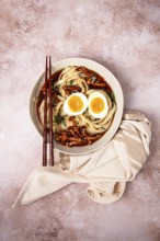Buckwheat noodles soba with shimeji mushrooms, with boiled egg, green onion, sesame seeds,