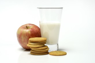 Cracker with glass of milk and apple