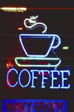 Illuminated advertising at a coffee shop, New York City, USA