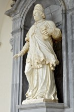Marble statue of Pope Clement XI by sculptor F. Marattis from Padua in the portico of the