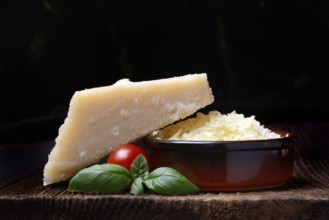 Parmesan cheese, grated cheese in rind and piece of Parmesan, Italy
