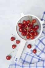Sweet cherries in sieve, Prunus avium, bird cherry, cherry