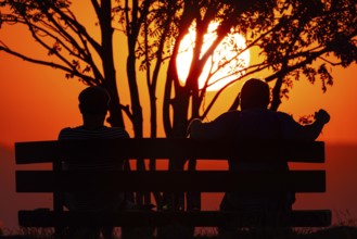 From the summit plateau of the GroÃŸer Feldberg in the Taunus mountains, two people watch from a
