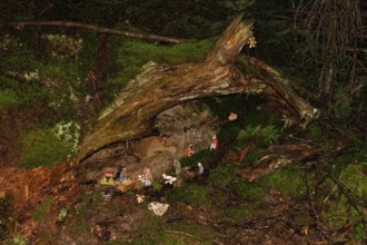 Mysterious cot, Christmas cot in natural surroundings, hidden in the forest, artists have built the