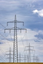 Many high-voltage power lines and lattice towers in the district of Ludwigsburg near Besigheim,