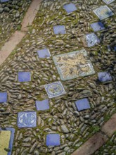 Street paving made of pebbles and tiles background, texture, Andalusia, Spain