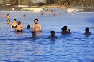 Tourists in thermal bath, outdoor pool, spa, BlÃ¡a LÃ³niÃ°, Blue Lagoon tourist attraction, hot