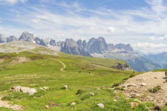 Panorama of a mountain path in the middle of a vast mountain landscape under a blue sky, Schlehrn