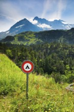 Prohibition sign Camping Verboten im Alpenraum on the Susten Pass with Chli Sustenhorn and