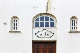 FaÃ§ade detail with door and windows, crack, Villa lettering, ReykjavÃ­k, Iceland