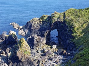 Rocky coast and rock gate on the south-east coast near the southern tip of Cornwall on the English