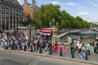 Tourists on Westminster Bridge, River Thames, Westminster, central London, England, UK