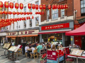 Red lanterns above Canton Chinese restaurant and bakery shop, Newport Place, Chinatown, West End,