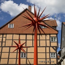 Artwork by Otto Piene entitled Fireworks for Celle in front of a half-timbered house in the