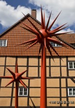 Artwork by Otto Piene entitled Fireworks for Celle in front of a half-timbered house in the
