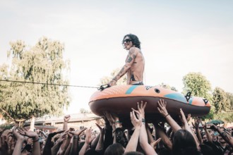 Remington Leith, singer of Palaye Royale on a rubber dinghy live in the Zitadelle Spandau, Berlin,