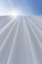 Modern white faÃ§ade made of corrugated acrylic glass, Plexiglas, SANAA production hall, architect