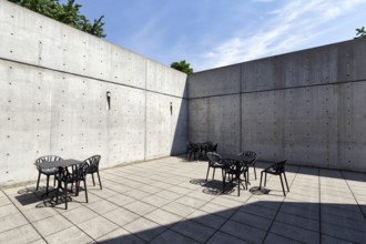 Conference pavilion, conference building, inner courtyard with seating areas, exposed concrete,